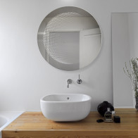 Miroir LED rond à effet 3D pour une touche moderne.