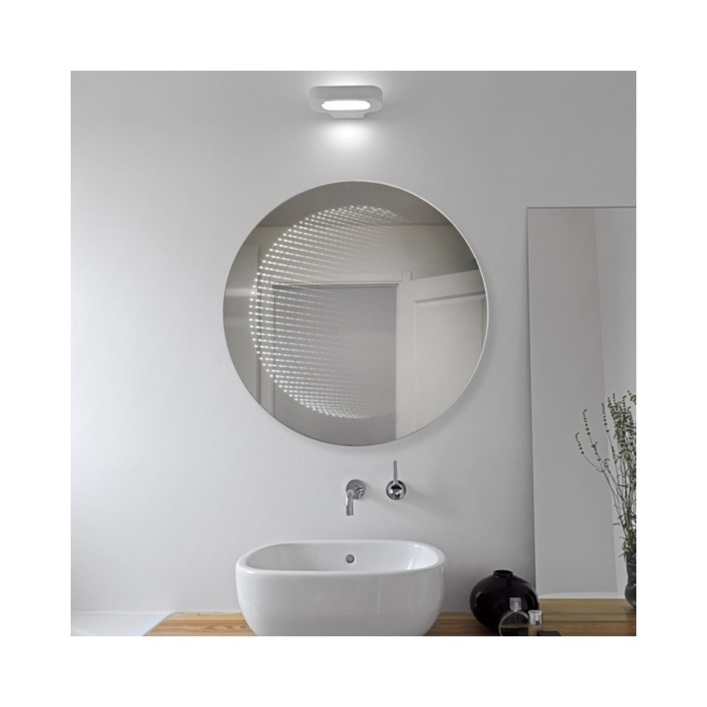 Miroir LED rond à effet 3D pour une touche moderne.